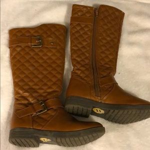 Restricted tall riding boots